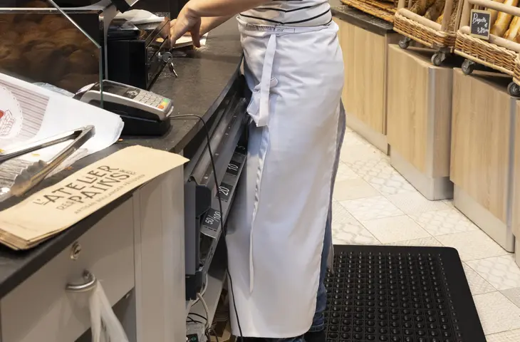 A baker wearing a short apron